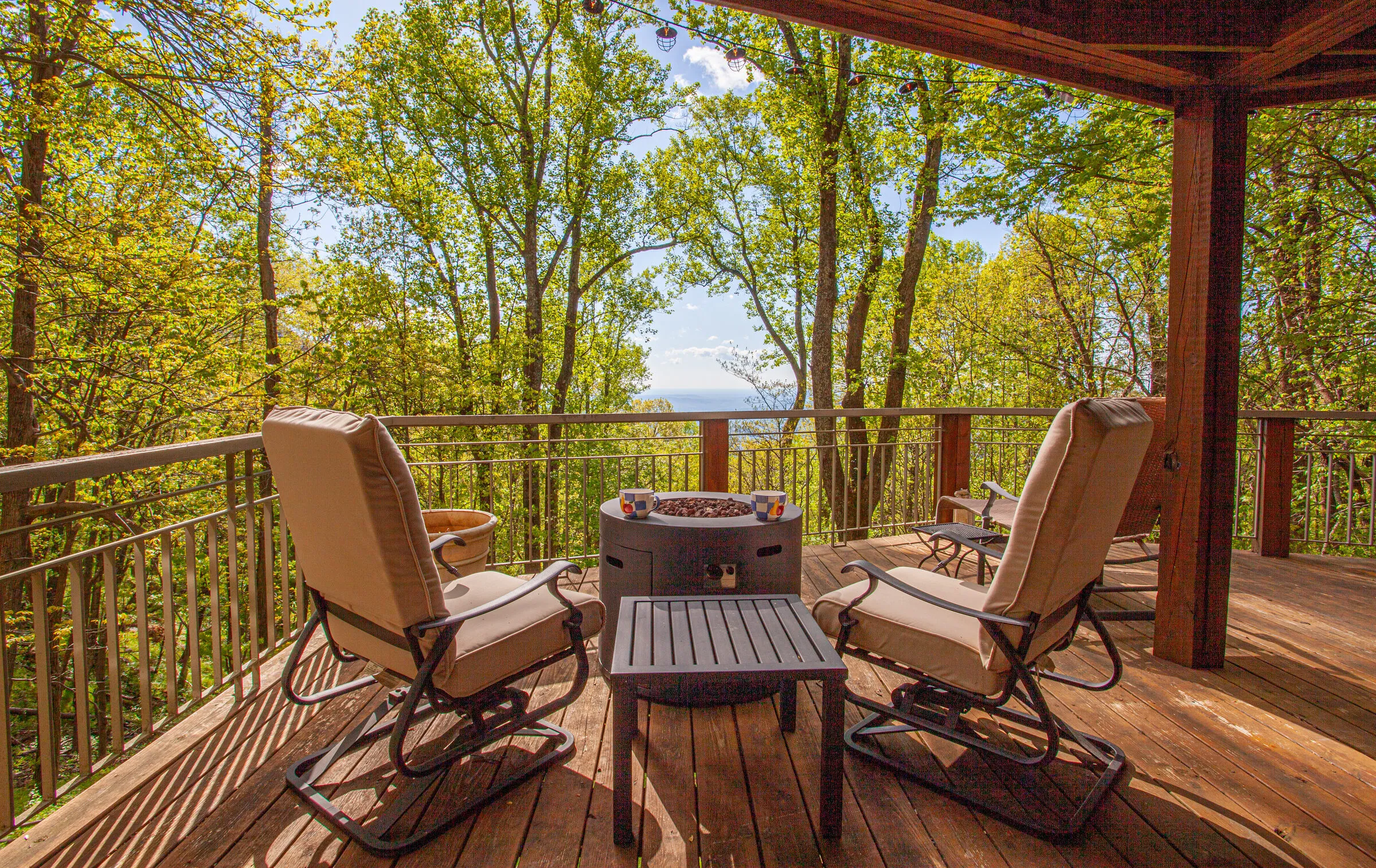 Lower deck with fire pit and lounge chairs